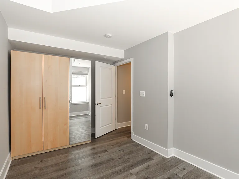 Spacious Bedroom with Large Closet and Hardwood Flooring