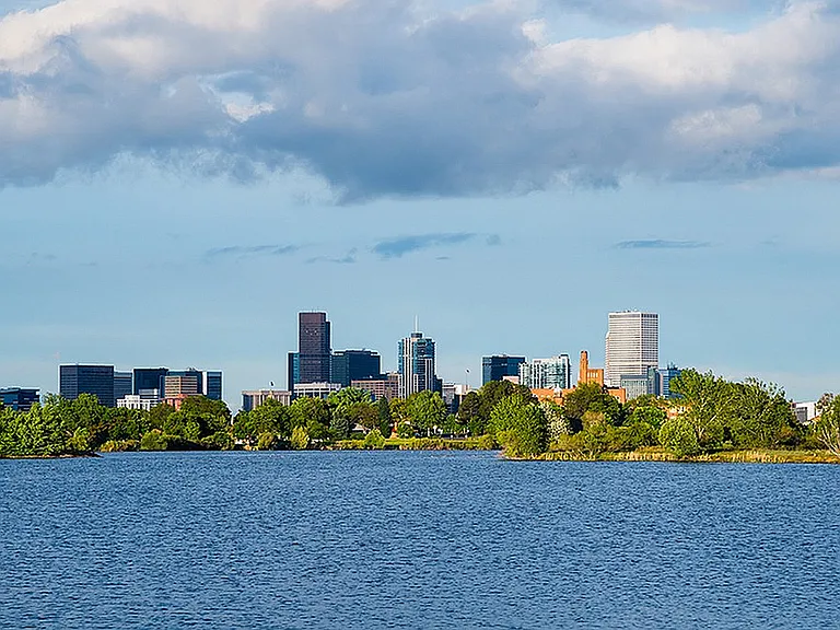 Experience the perfect blend of urban living and natural beauty with this breathtaking lakeside city view.