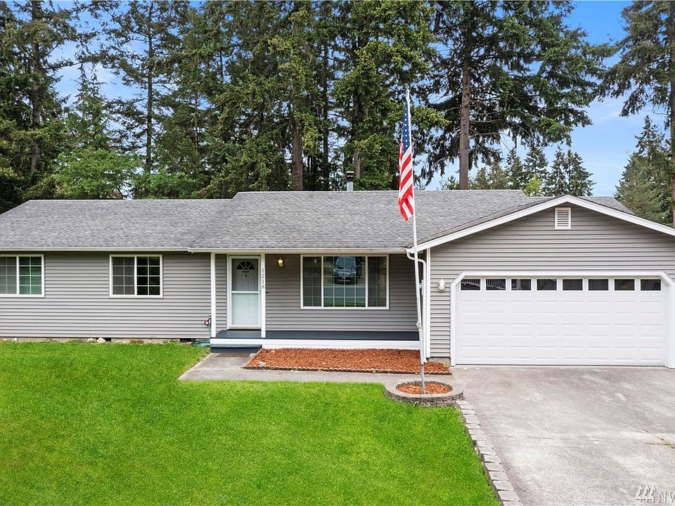 Clean curb appeal, freshened up landscaping, new paint on entry & trim.
