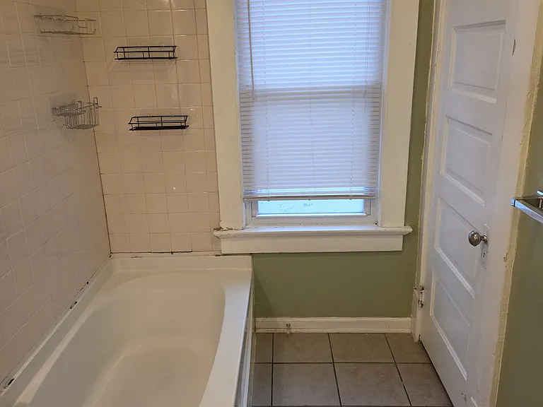 first bathroom with bath tub.