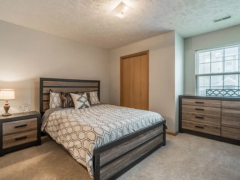 Retreat to a peaceful bedroom designed for rest, with plenty of space for your favorite furniture and cozy touches.