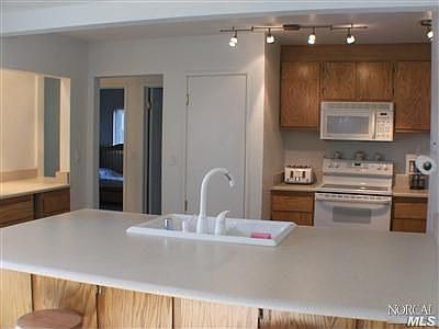Remodeled kitchen has lots of counter space.