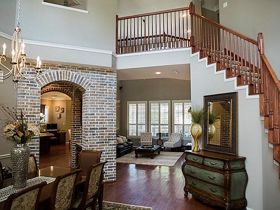 Elegant entry leads you into the spacious foyer and open living areas beyond.