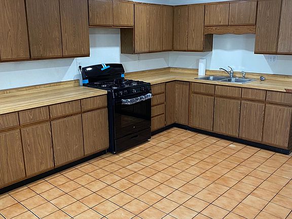 Kitchen includes plenty of countertop space, storage and room for your dining table