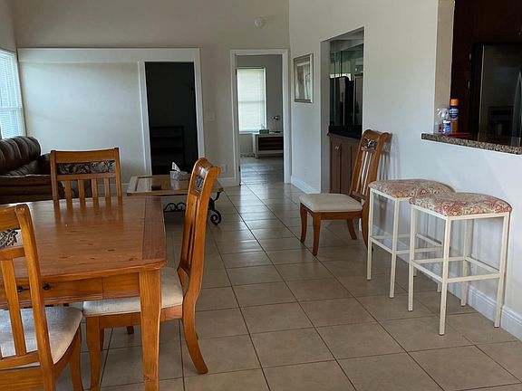 View from front door entrance / dining and living room .
