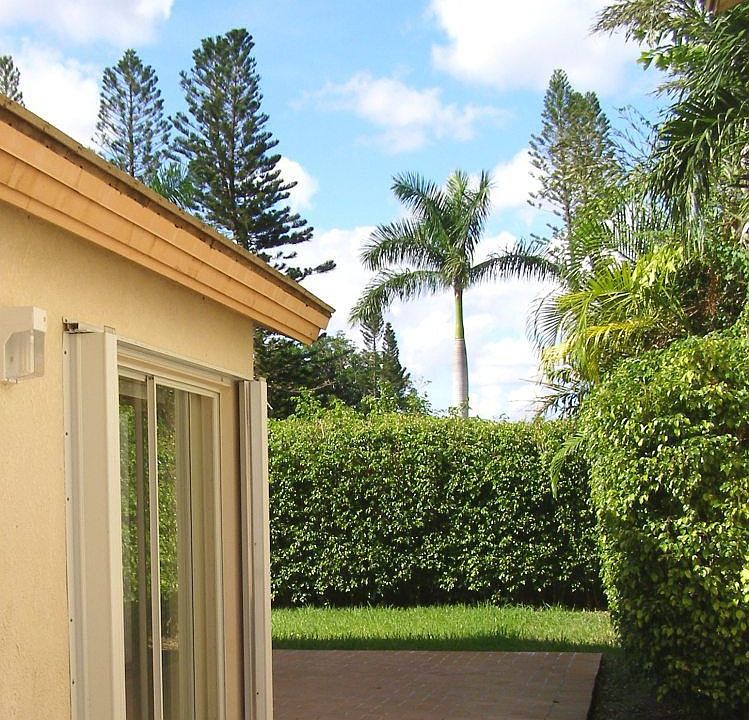 View from the side to the back patio. Don't you just love the green?!
