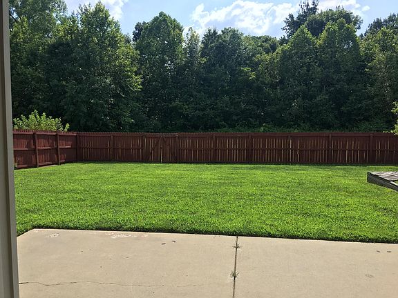 Totally fenced yard with gate in the back and side for easy access