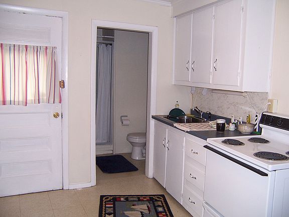 Kitchen with 3/4 bath on end.