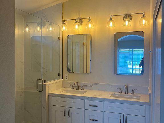 Newer walk in tile shower, vanity & toilet.