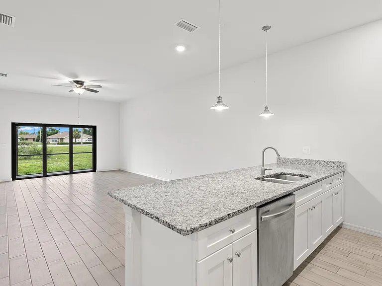 Bright, airy, open floor plan with high ceilings: Living, dining, kitchen island