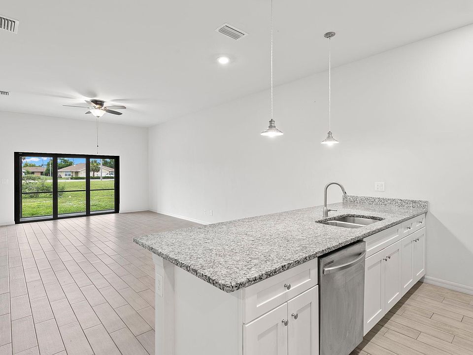 Bright, airy, open floor plan with high ceilings: Living, dining, kitchen island