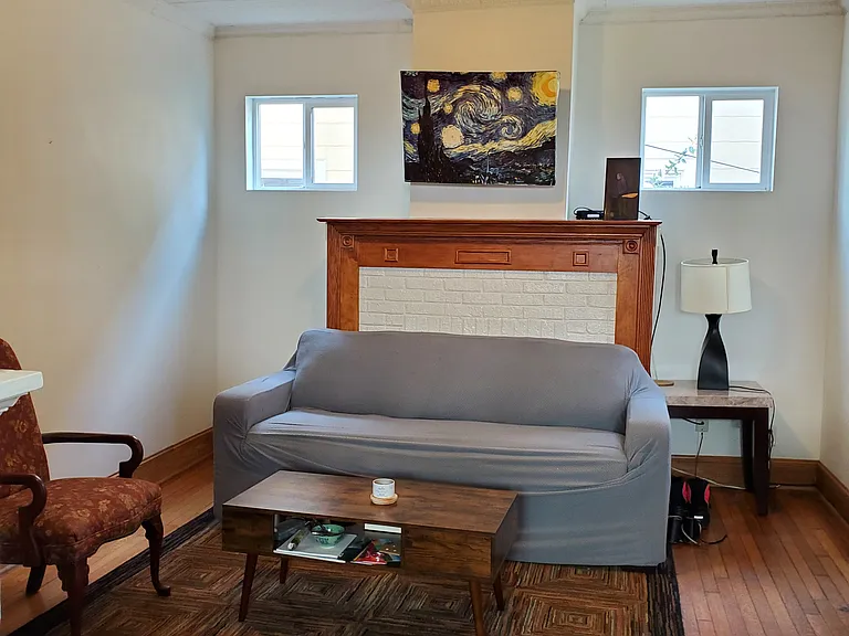 Furnished living room. Housemates may move furniture around and add their own home decor.
