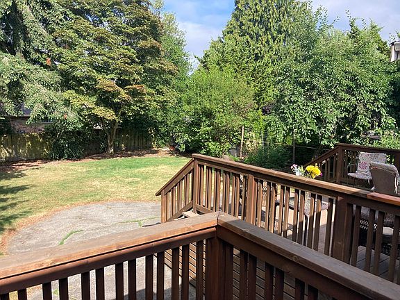 Large back yard with deck access from kitchen and master bedroom