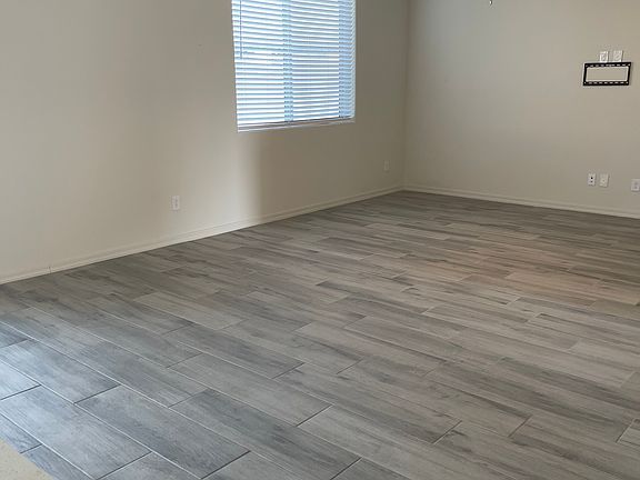Large family room area with in wall electrical conduit to hide cords.