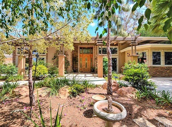 Front yard with drought tolerant plants and trees.