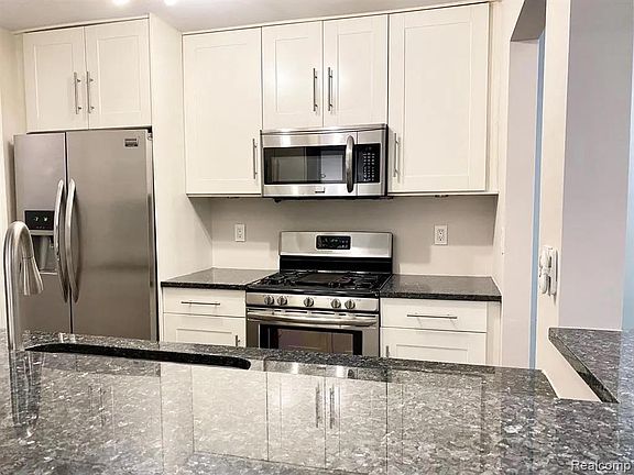 Custom IKEA Kitchen. Soft-close drawers and cabinets. Norway Blue Pearl Granite Countertop.