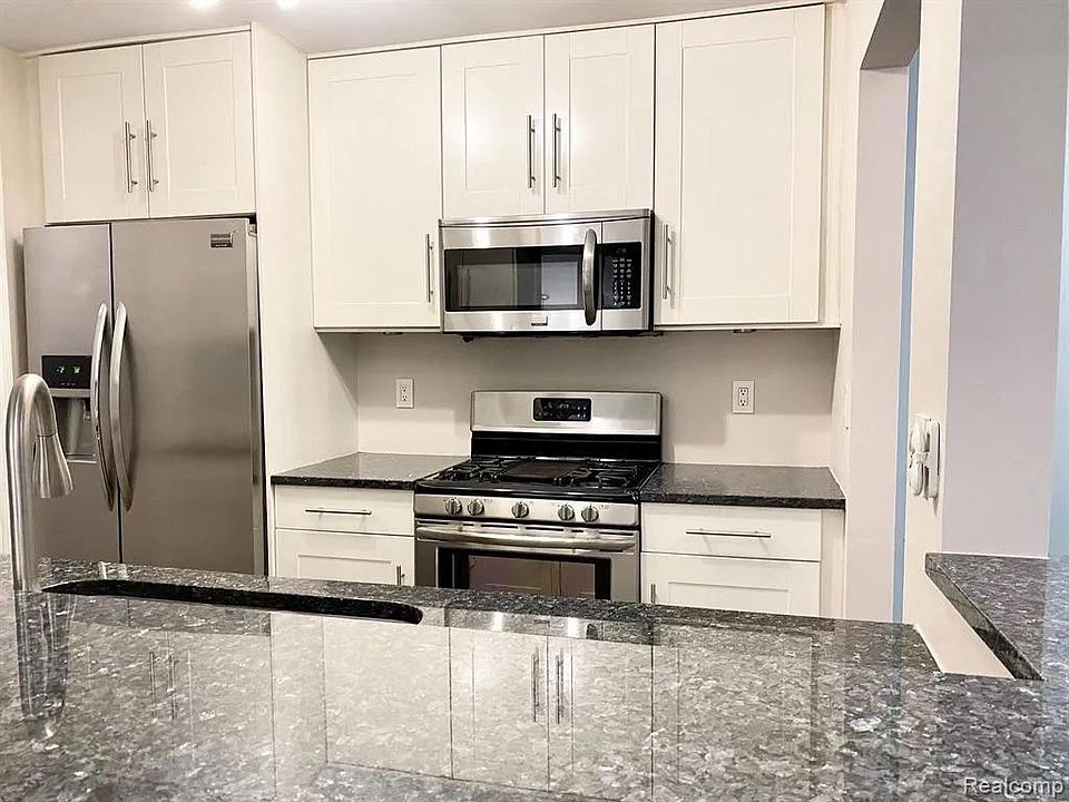 Custom IKEA Kitchen. Soft-close drawers and cabinets. Norway Blue Pearl Granite Countertop.