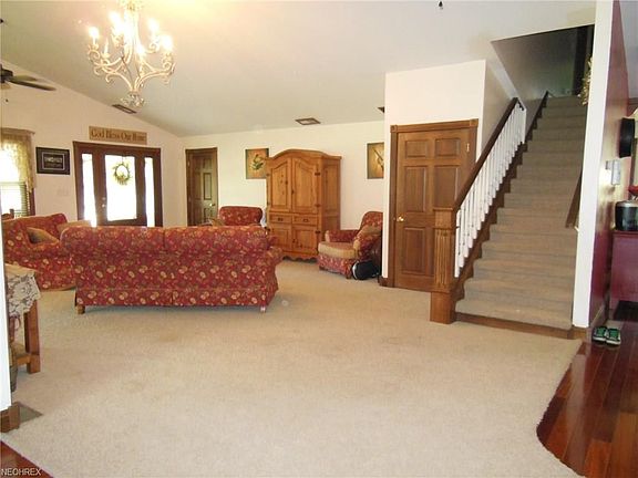 The entire lower level features vaulted ceilings and fantastic open space! This view through the 19x19 foyer toward the front door also shows the stairway to second level.