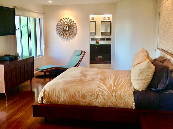 Master bedroom, with bathroom, jacuzzi tub, walk in closet and private covered patio with skyline views