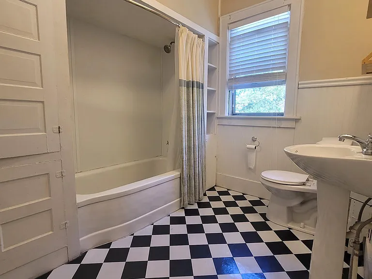 Bathroom with lots of built and storage for tiles and linens.