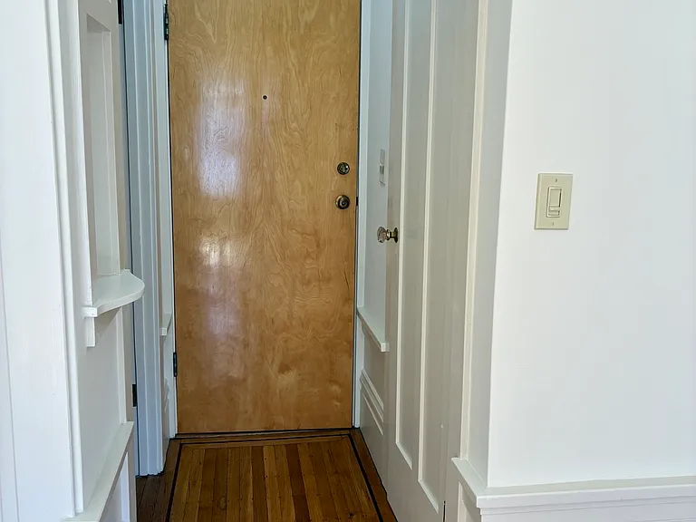 Entry hallway with hardwood floors
