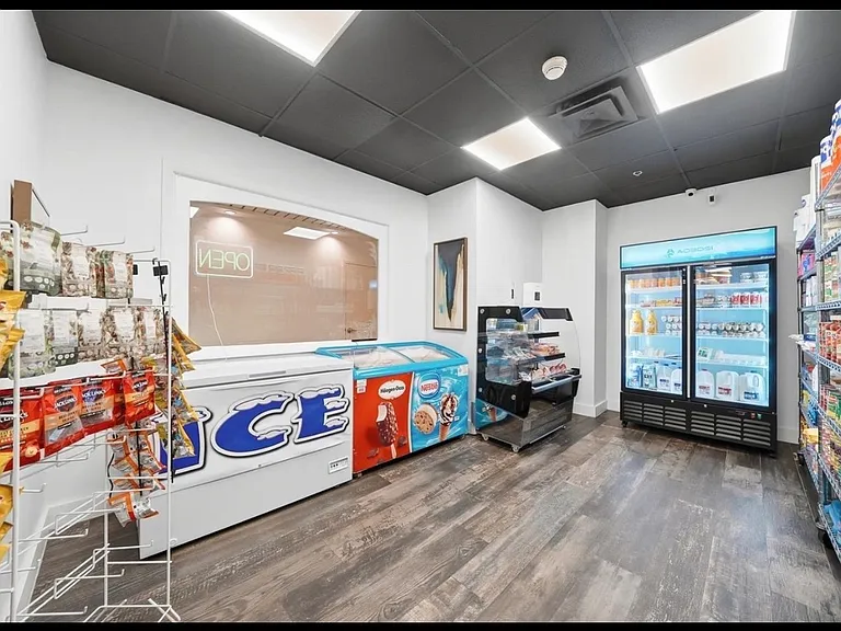 Luxury building's amenities: CAFE & MARKET, great for a croissant or an empanada & a cafecito on your way to work