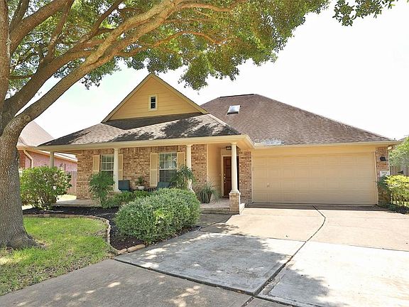 Beautiful mature trees, double wide driveway, and freshened landscape.