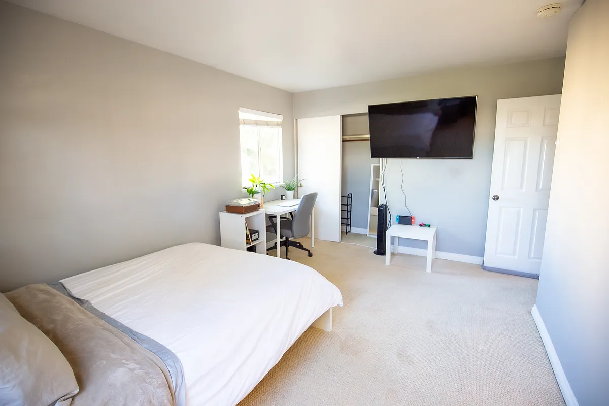 Fully furnished room with queen bed, mattress, desk, chair, tower fan, shelving for organization, 50 inch smart TV, etc - 18202 Larkstone Dr