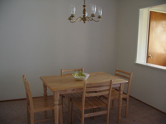 Bright dining room with chandelier