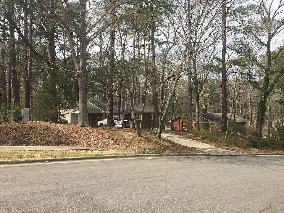 three bedroom, three bathroom brick ranch, large lot, driveway parking.