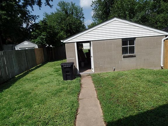 entry from garage with walkway to house