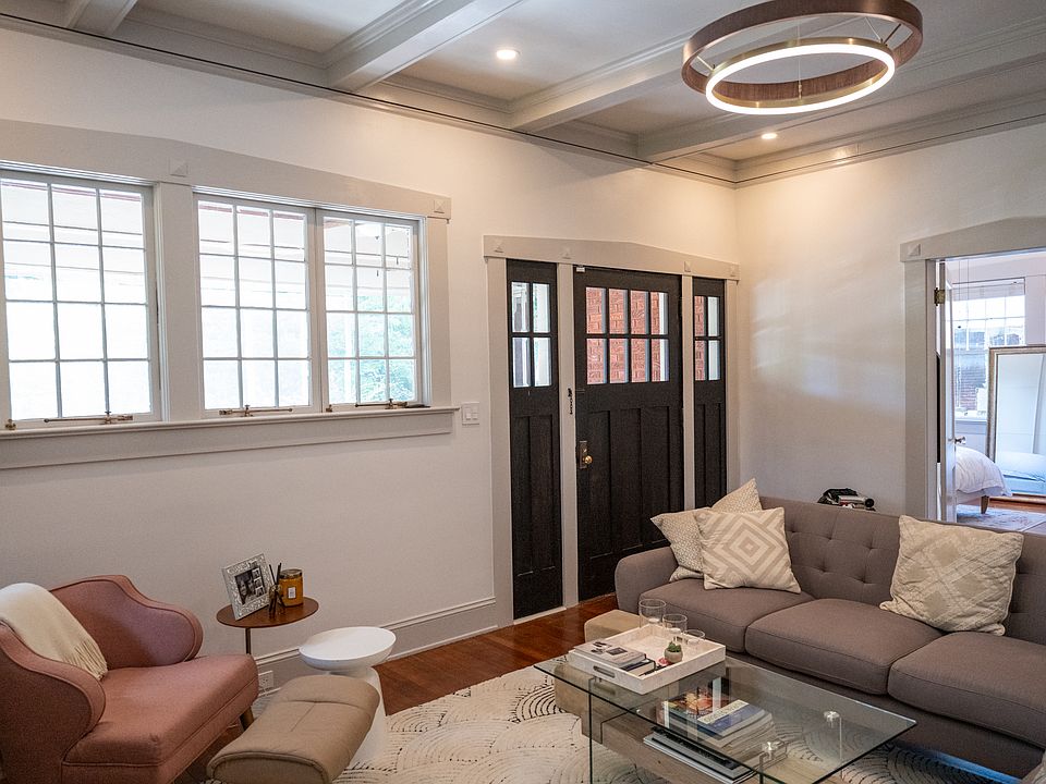 Living room, entry, and front master bedroom (background)
(furnishings not included)