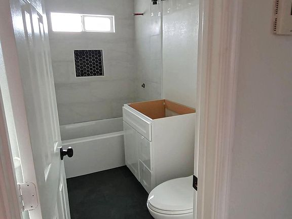 Actual remodeled bathroom, countertop and sink have not been installed yet.