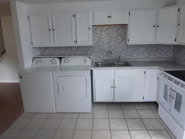 includes washer/dryer