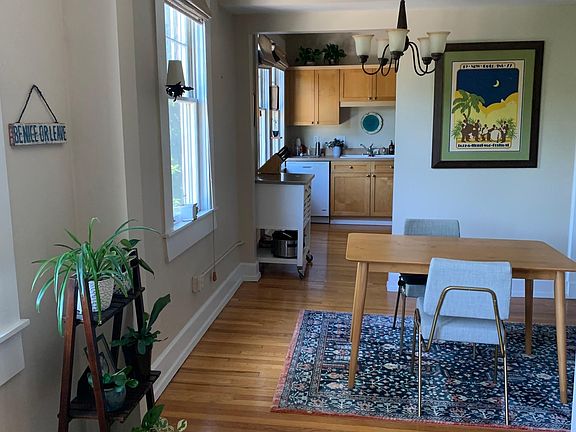 Living room flows into dining and kitchen. Lots of windows and natural light!