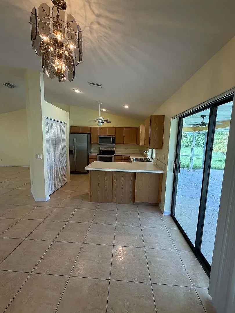 Inviting 3/2 Pool Home With Spacious Lanai and Modern Kitchen — Photo 3