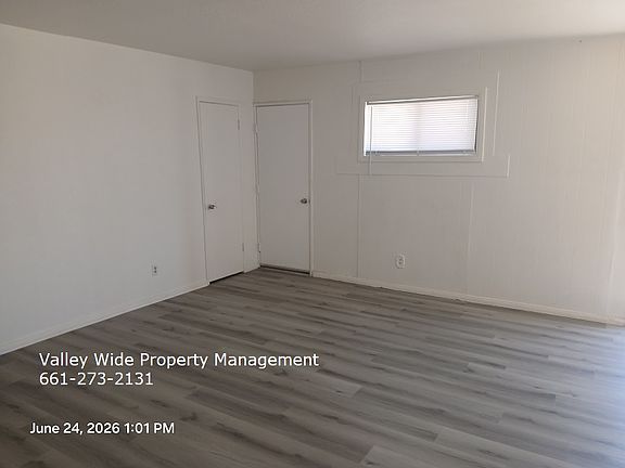 living room, closet, door to garage