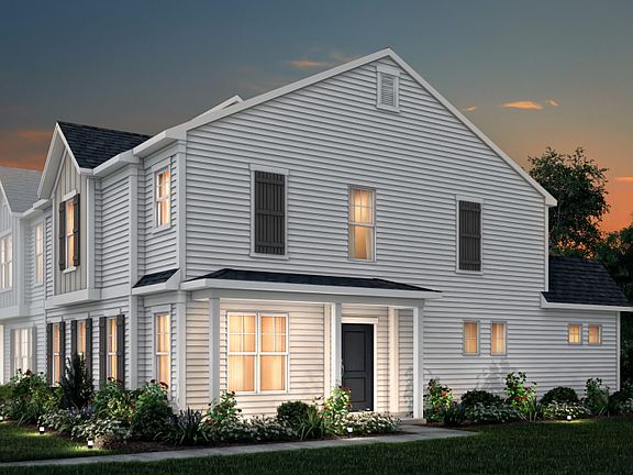 Sharon Exterior 22B features siding, covered front door and 2-car rear load garage