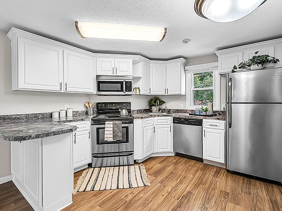 Updated kitchens with stainless steel appliances.