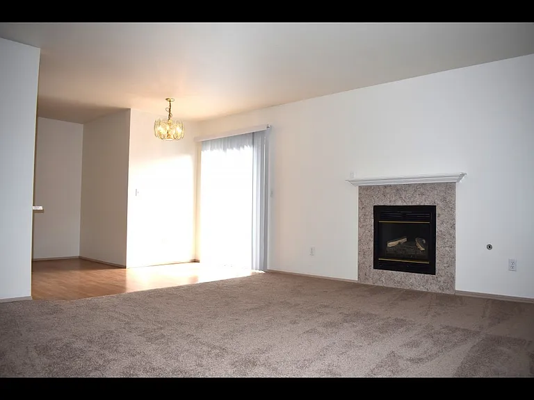Town home showing dining area and gas burning fireplace.