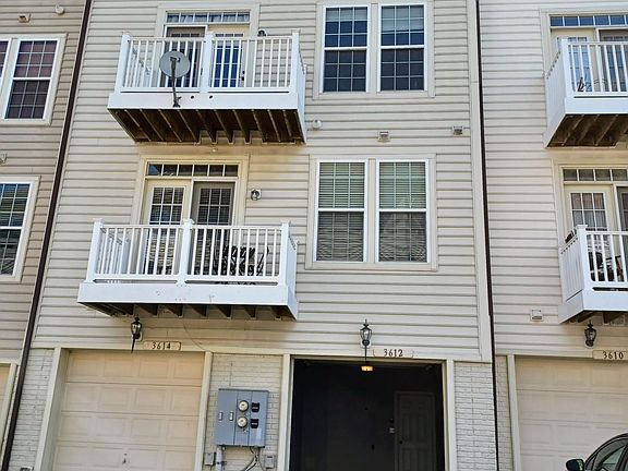 Garage and balcony at back of the building.