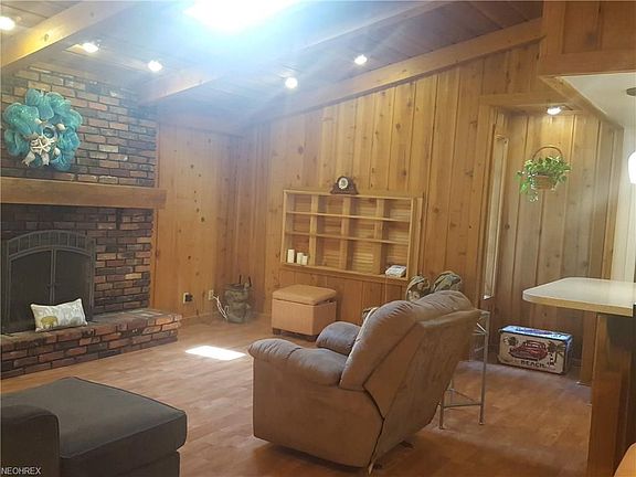 First level living room with attractive fireplace and built ins. This room opens to the kitchen and dining area. Has a skylight and vaulted ceiling.