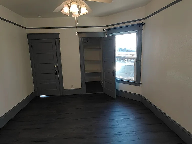 flont bedroom with closet (R) open, and door to entry (L) closed