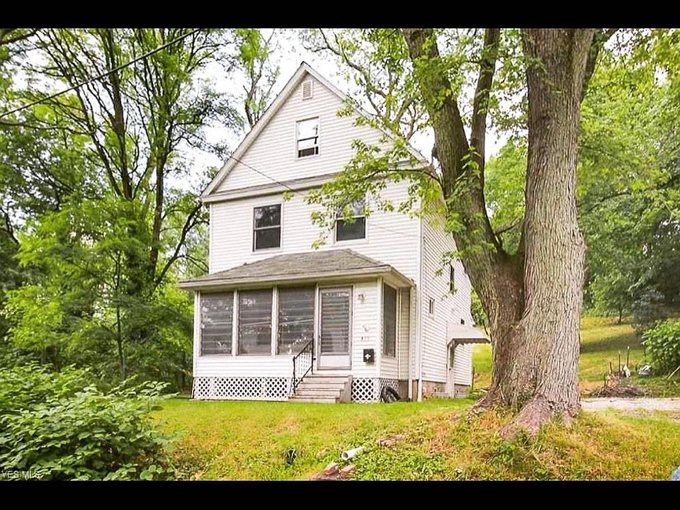 Screened in front porch/sunroom.