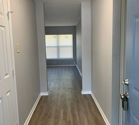 Entry has coat closet to the left. To the right is the master suite and also the personnel door to the garage. Living room is straight ahead.