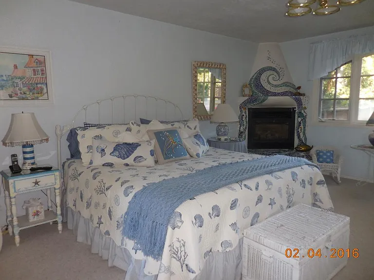 Lower bedroom with mosaic fireplace