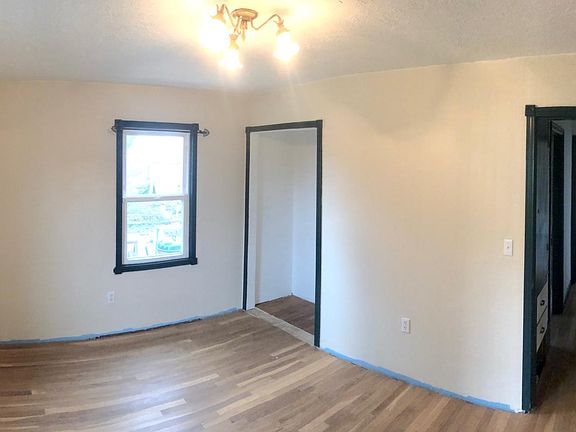 Lower level bedroom with south and east facing windows.