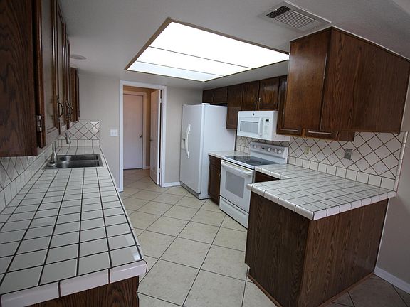 Kitchen looking to laundry room and pantry