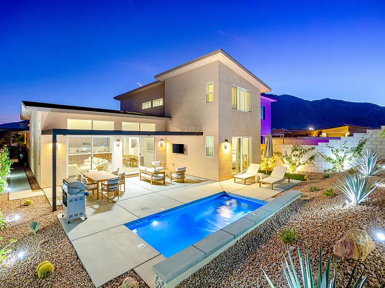 The whole place lit up at night _ pure Palm Springs magic.