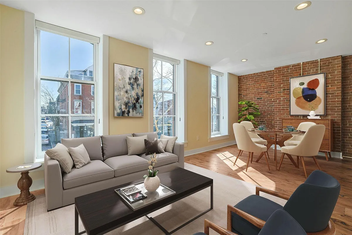 Living Room: Virtually staged living and dining areas with floor-to-ceiling windows. - 19 Main St #2